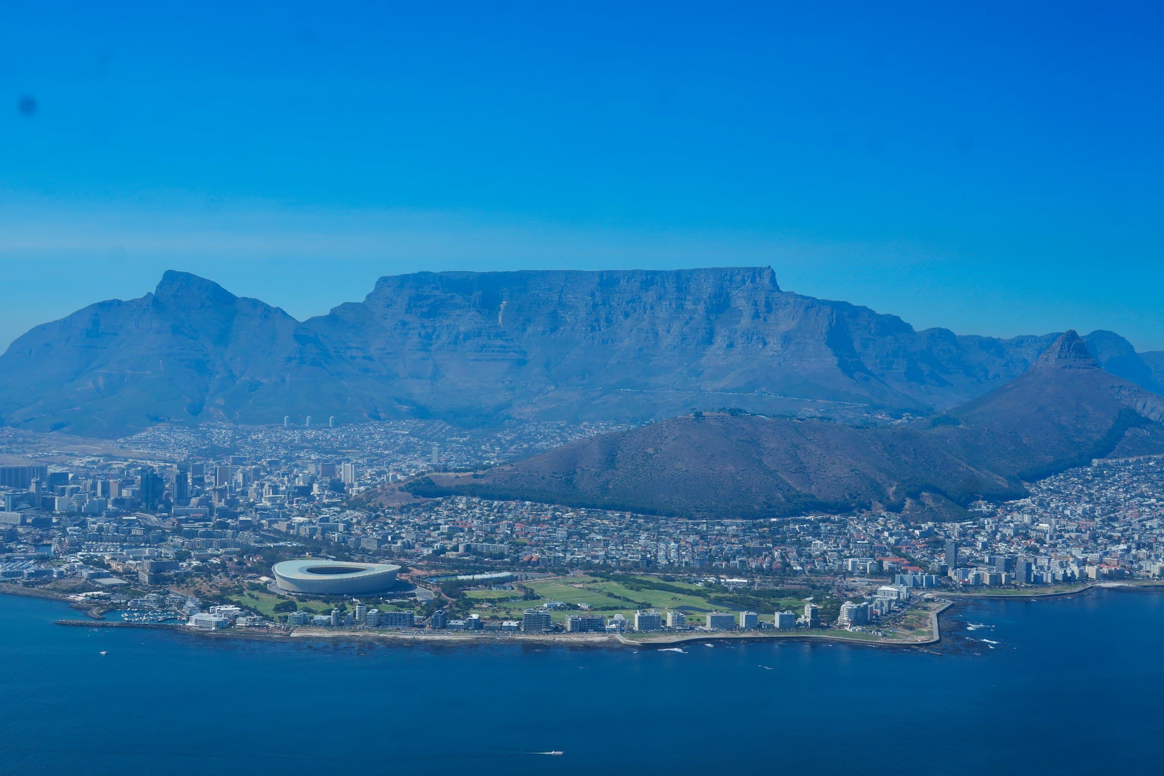 Aerial view of Table Mountain rising above the coastal city of Cape Town