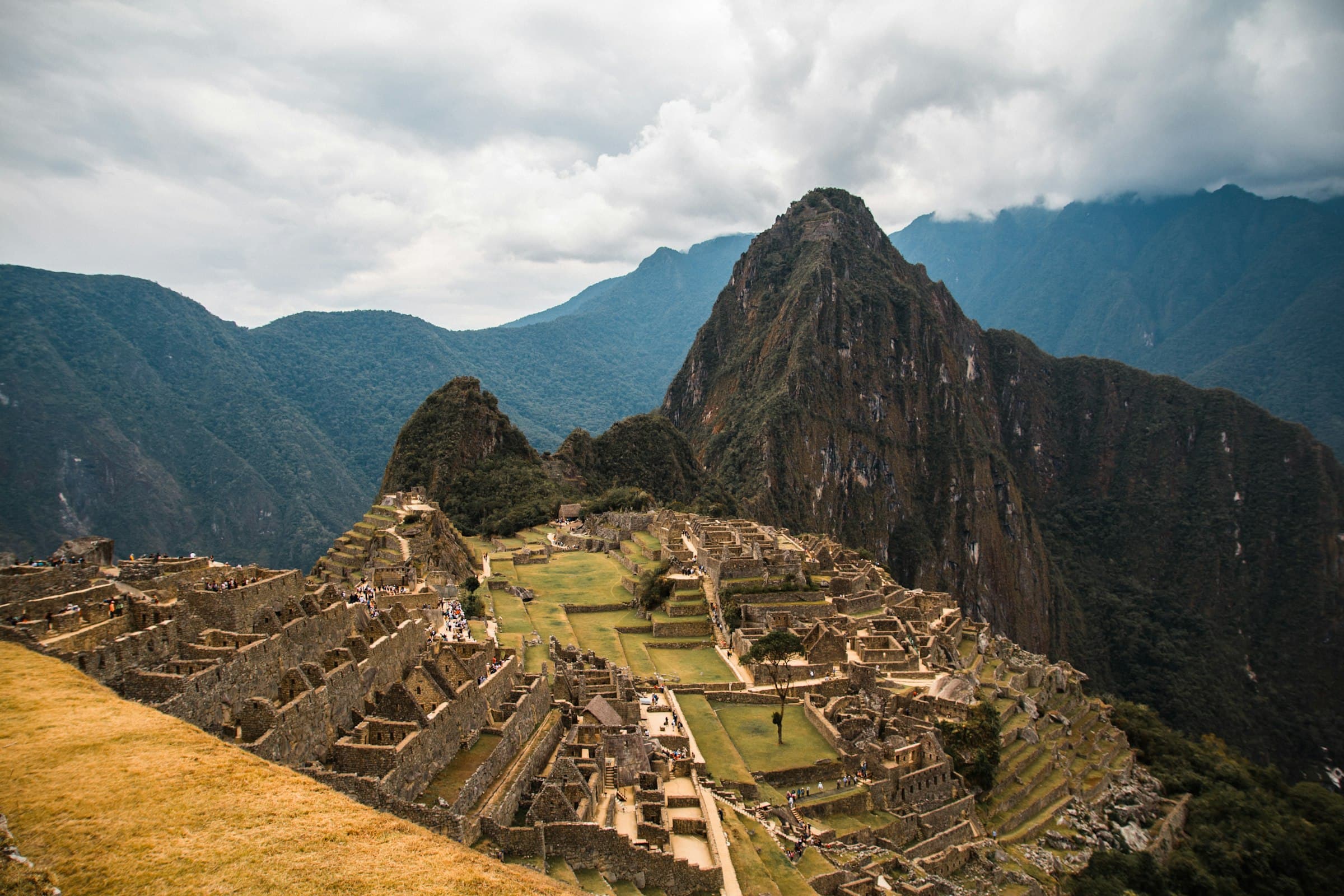 The ancient Incan citadel of Machu Picchu set among green mountain peaks in Peru